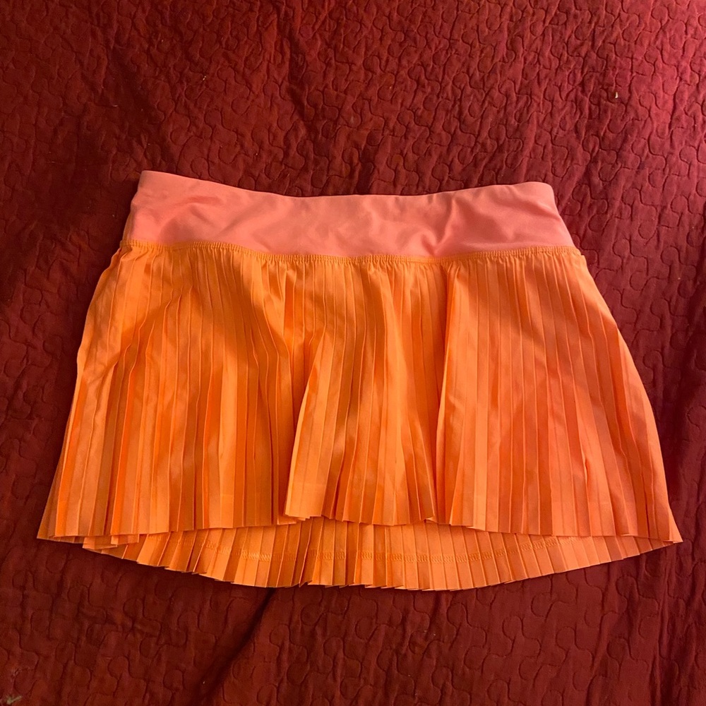 Lululemon active wear cute orange tennis skirt with inner liner never worn Sz 8